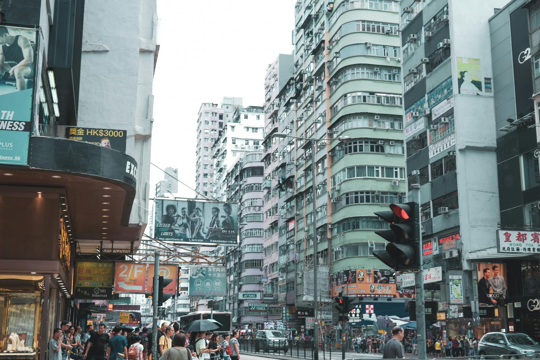 Expats and newcomers walking through a busy Hong Kong street, learning to adapt to local culture